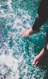 High angle view of person splashing water