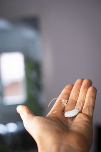 Close-up of hand holding cigarette