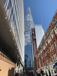 Low angle view of modern buildings against clear sky