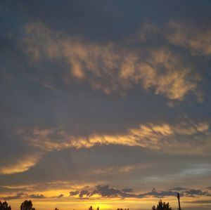 Low angle view of dramatic sky during sunset