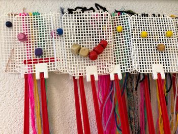 High angle view of multi colored flags hanging on wood