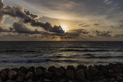 Scenic view of sea against sky during sunset