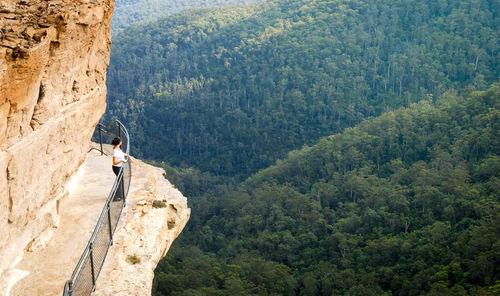 Woman standing on rock formation