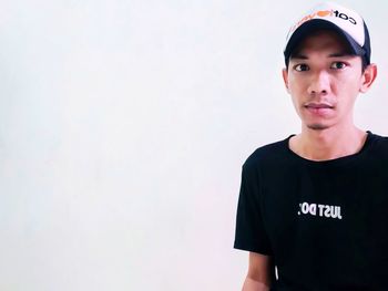Portrait of a young man against white background