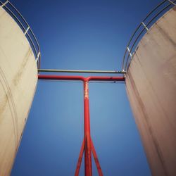 Low angle view of fuel storage tank against sky