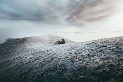 Scenic view of snowcapped mountain against sky during winter