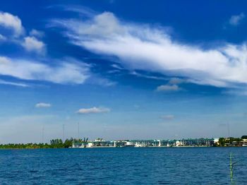 Scenic view of sea and buildings against sky