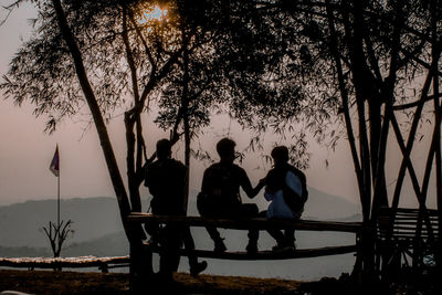 Rear view of silhouette people looking at view