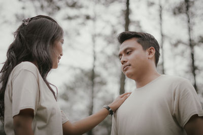 Man and woman looking at camera