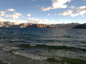 Scenic view of sea against cloudy sky