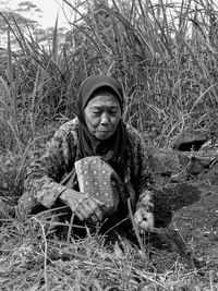 Full frame shot of plants and old woman