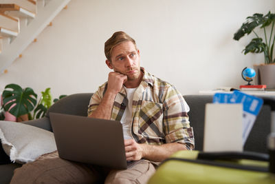 Young woman using laptop at office