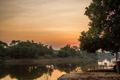 Scenic view of lake against sky during sunset