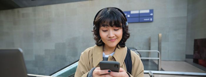 Young woman using mobile phone