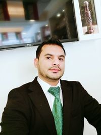 Portrait of mid adult man standing at home