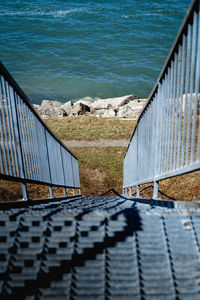 High angle view of footpath by sea