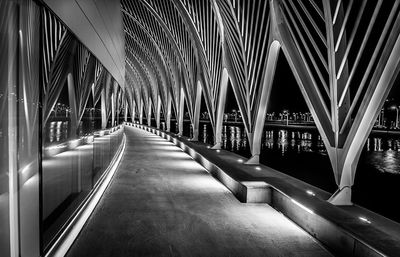 Empty road with bridge in background