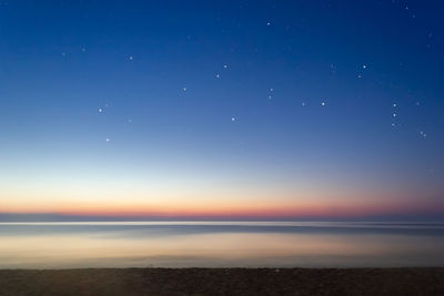 Scenic view of sea against sky at night