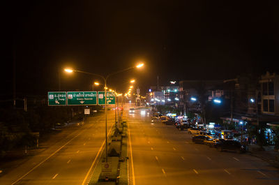 Cars on road in city at night