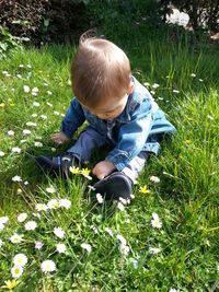 Girl standing on grassy field