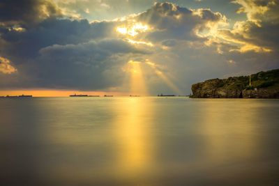 Scenic view of sea against sky at sunset