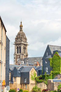 Buildings in city against sky