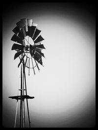 Low angle view of wind turbine against sky