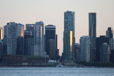 Modern buildings in city against sky