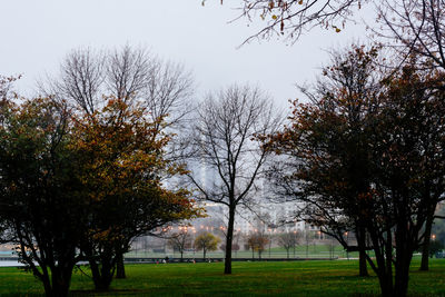 Trees on field against sky during autumn