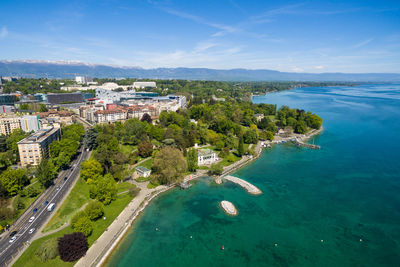 High angle view of sea and buildings against sky