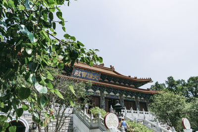 Low angle view of temple against building