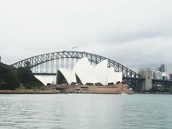 View of bridge over river against buildings