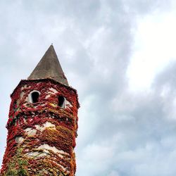 Low angle view of built structure against clouds