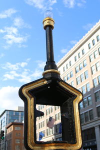 Low angle view of clock tower against sky