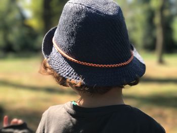 Rear view of child wearing hat
