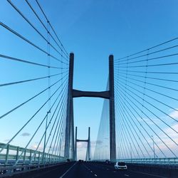 Low angle view of second severn crossing against sky during sunset