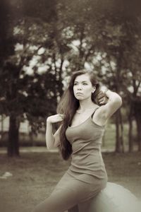 Portrait of young woman sitting outdoors