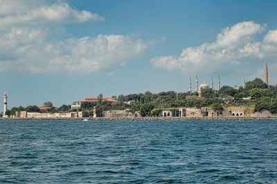 View of built structures against blue sky