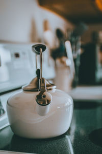 Close-up of tea cup on table at home