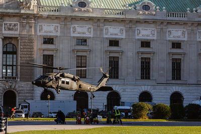 Helicopter near buildings in the city