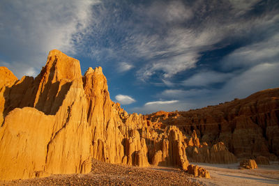 Panoramic view of rock formations on landscape against sky