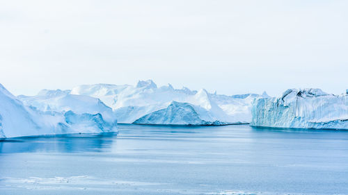 Scenic view of frozen sea against sky