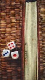 Directly above shot of dice on tatami mat