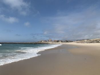 Scenic view of beach against sky