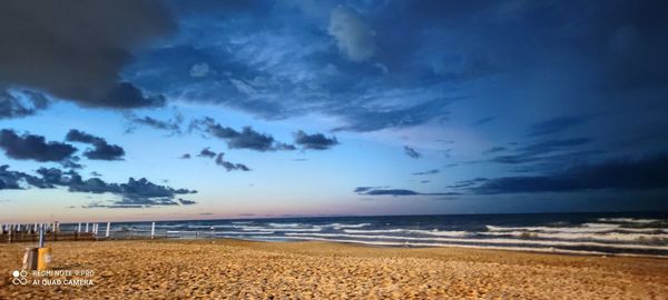 Scenic view of sea against dramatic sky