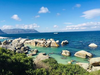 Panoramic view of sea and rocks against sky