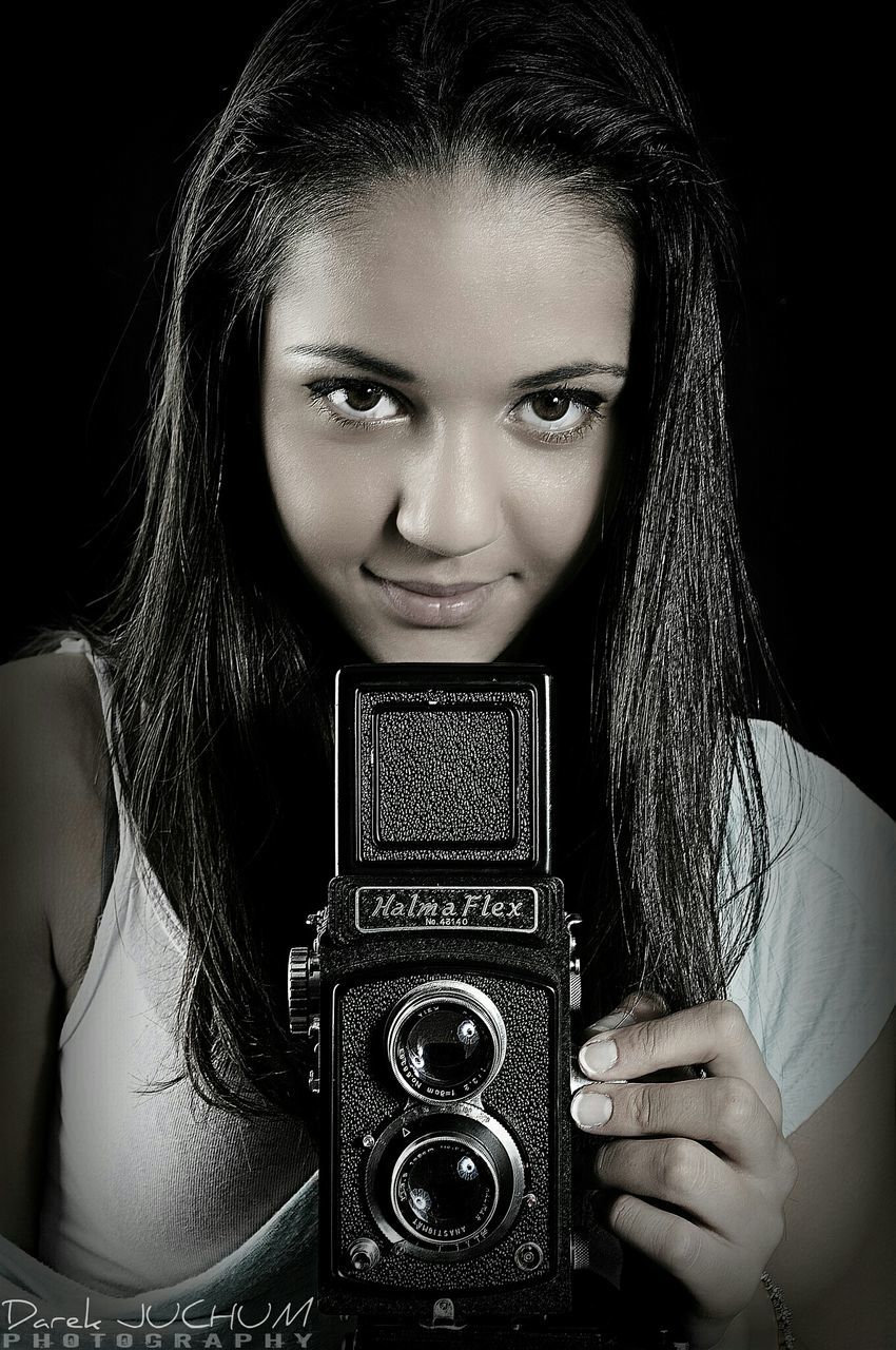 young adult, young women, portrait, lifestyles, looking at camera, front view, person, indoors, leisure activity, headshot, casual clothing, close-up, long hair, studio shot, black background, human face, fashion