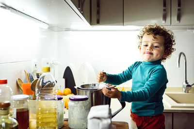 Cute girl making food in kitchen