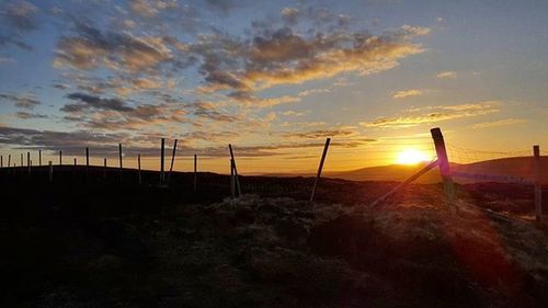 Scenic view of landscape at sunset