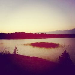 Scenic view of lake at sunset